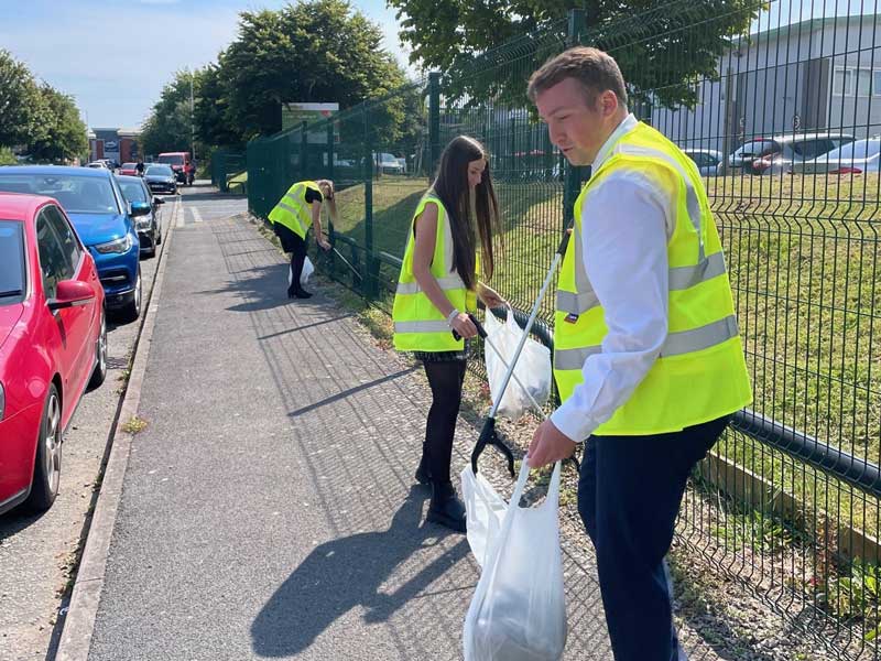 ADC staff volunteers clearing up the Bromborough Estate