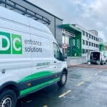 engineer on site repairing automatic doors