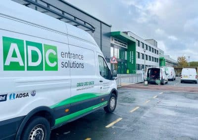 engineer on site repairing automatic doors